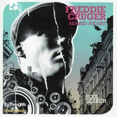 "CD cover with 'You Are Here' sign amidst a blurry, fiery scene."