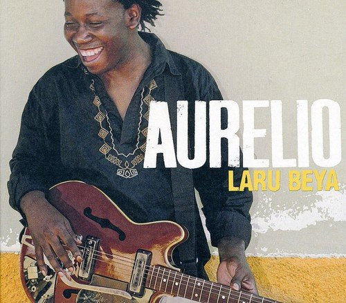 Man playing guitar, smiling, with "AURELIO" and "LARU BEYA" text on beige background.