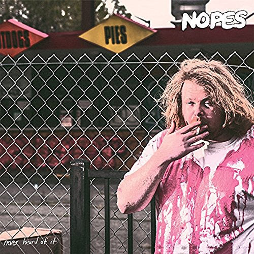 CD cover featuring a man smoking by a chain-link fence and signs.