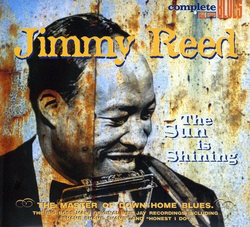 CD cover featuring a man playing a guitar against a rusty metal background.