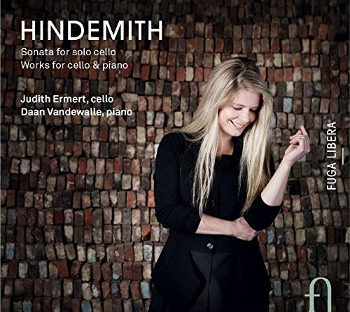 CD cover featuring a blonde woman in black against a brick wall background.