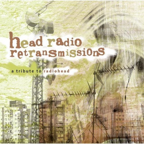 CD cover with cityscape, antennae, and distorted face, titled "head radio retransmissions".