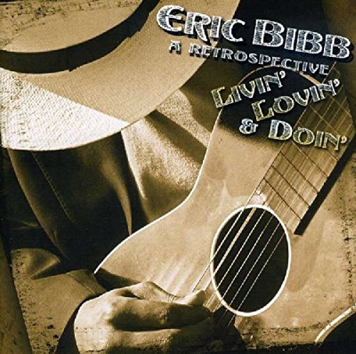 "Sepia-toned album cover with a man holding a guitar and wearing a hat."