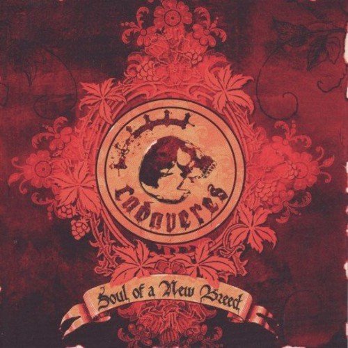 Red and orange album art featuring a skull emblem and ornate floral patterns.