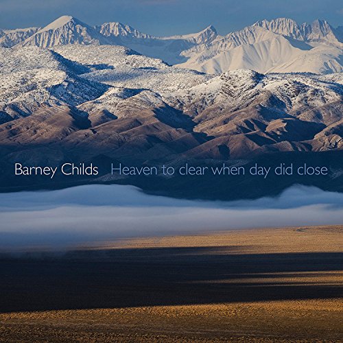 "Album cover featuring a serene landscape with snow-capped mountains and foggy valley below."