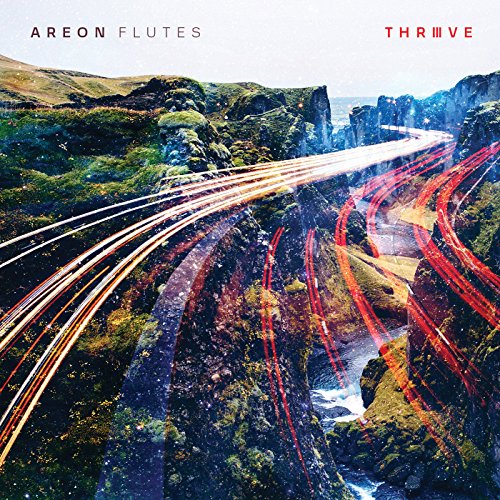 CD cover: winding road through a rocky, green landscape with light trails.