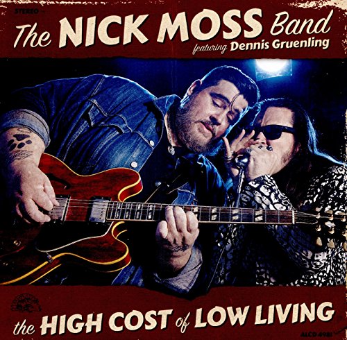 Album cover: man playing guitar, another man singing into microphone, on red background.