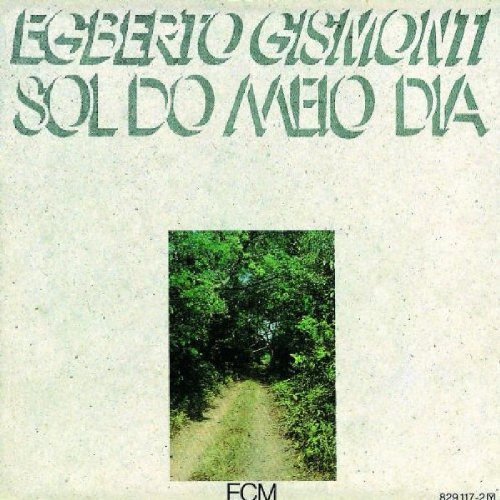 "Album cover with a dirt path through trees, artist and title in green text."