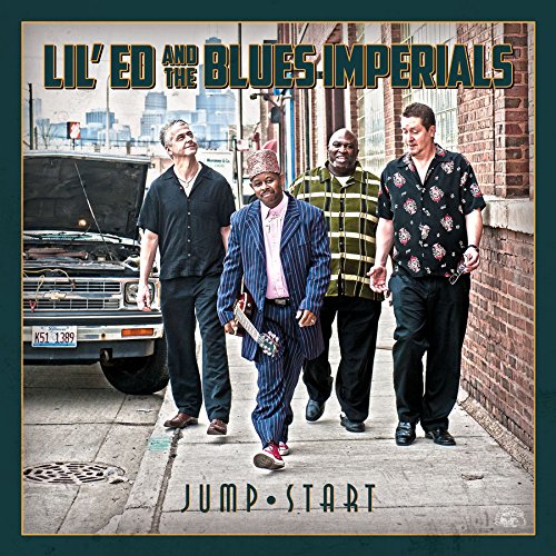 "CD cover with four men walking on a city sidewalk, holding guitars."