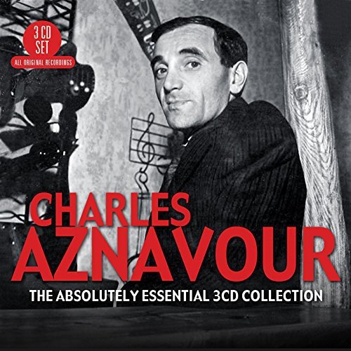 "Black and white photo of Charles Aznavour on a CD cover with red text."