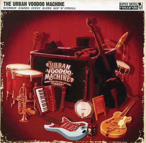 "Album cover featuring musical instruments and a trunk with 'Urban Voodoo Machine' text."