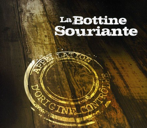 A CD cover with a wooden background and a gold circular stamp.