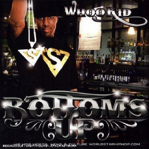 "Album cover featuring a man in a black shirt with a gold logo."