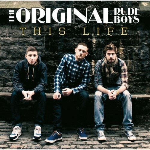 Album cover with three men sitting on stone steps, casual attire, against a stone wall.