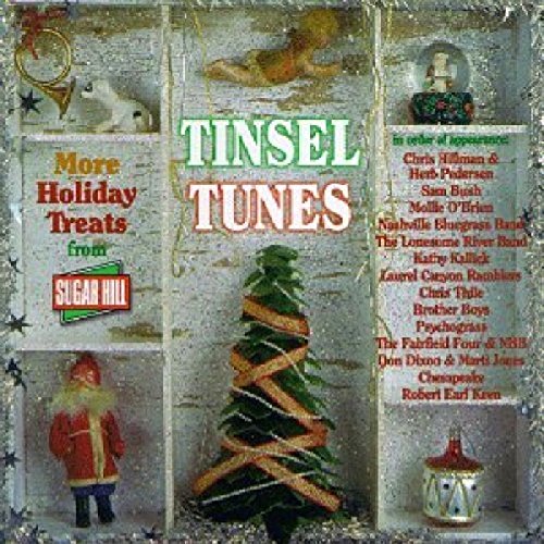 "Tinsel Tunes" Christmas album cover featuring a miniature tree and festive decorations.