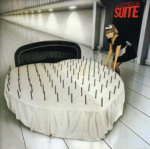 CD cover: a bed with spikes, a maid, and a long hallway.