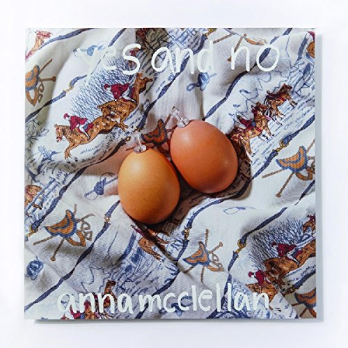 The alt text for the image is: "Album cover with eggs on a patterned cloth."