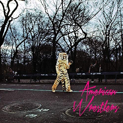 "Album cover with a person in a tiger costume standing on a road."