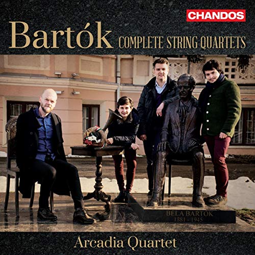 CD cover featuring four men around a statue with a building in the background.