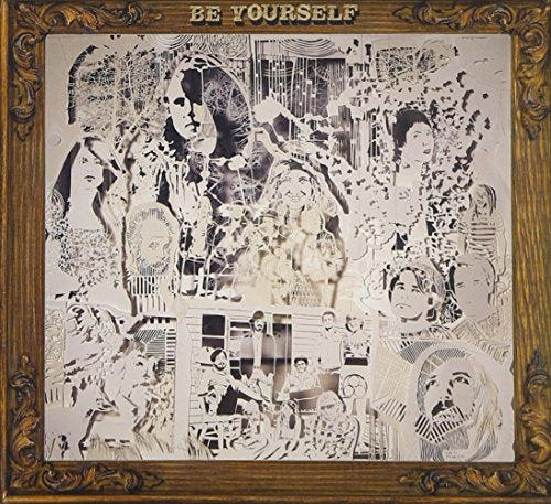 A CD cover with a gold frame and a black and white collage.