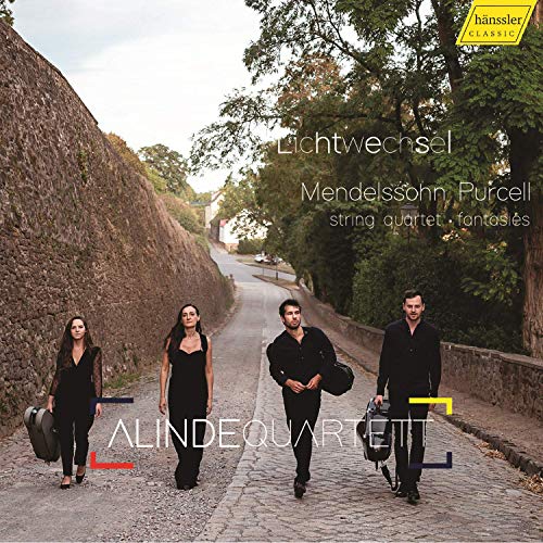 "CD cover featuring four musicians in black walking on a cobblestone road."