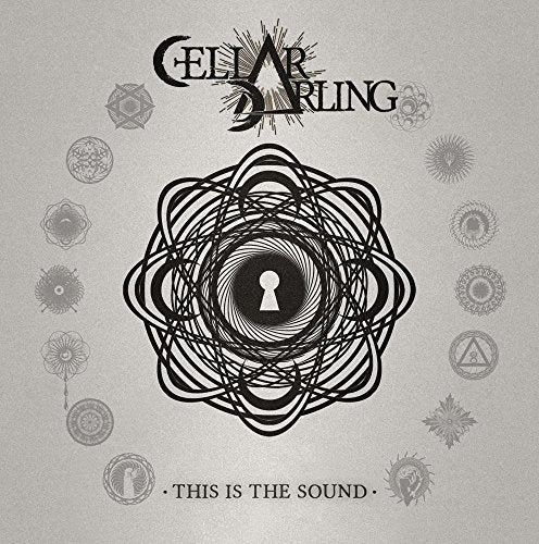 Album cover with black swirling design and keyhole on a grey background.