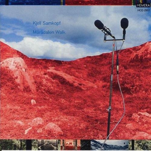 "CD cover featuring red rocky landscape with two microphones on a stand."
