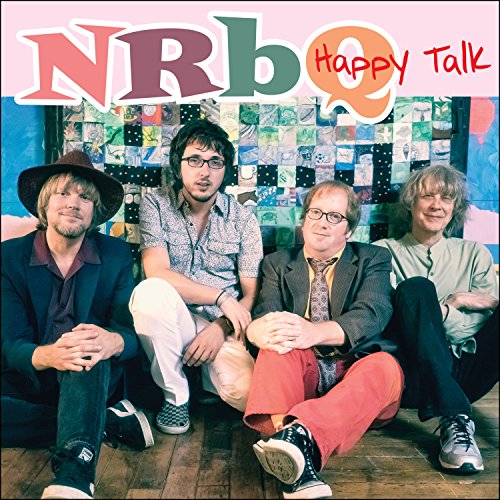 "NRBQ band members sitting on the floor, looking at the camera, on album cover."