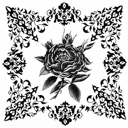 Black and white floral design featuring a rose within ornate swirls.