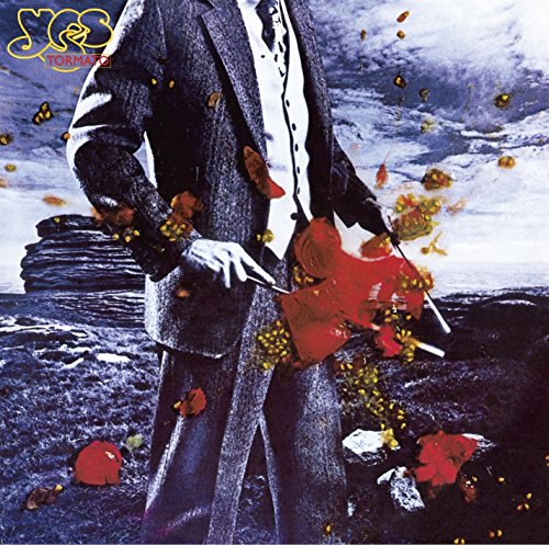 The image is an album cover for "Tormato" by Yes. "Album cover featuring a man in a suit, surrounded by floating red flowers."