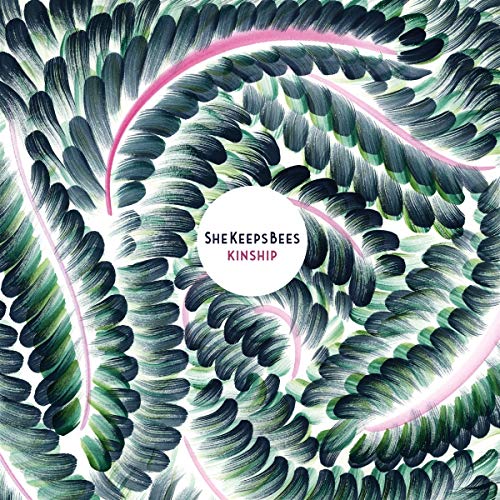 "Album cover with spiral feather pattern and 'She Keeps Bees Kinship' text."