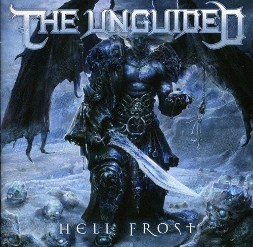 Dark armored figure with wings stands amidst skulls, holding sword and severed head.