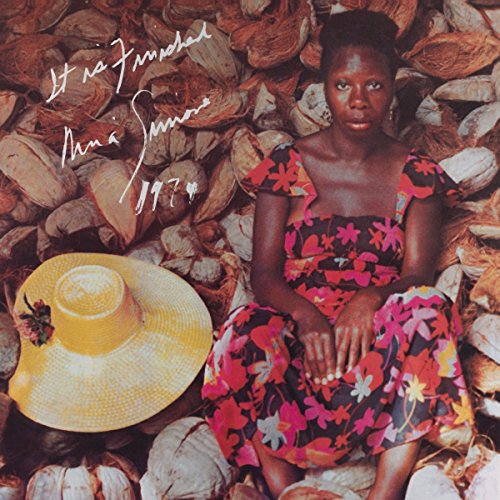 Nina Simone album cover: portrait amidst textured, earthy tones and straw hat.