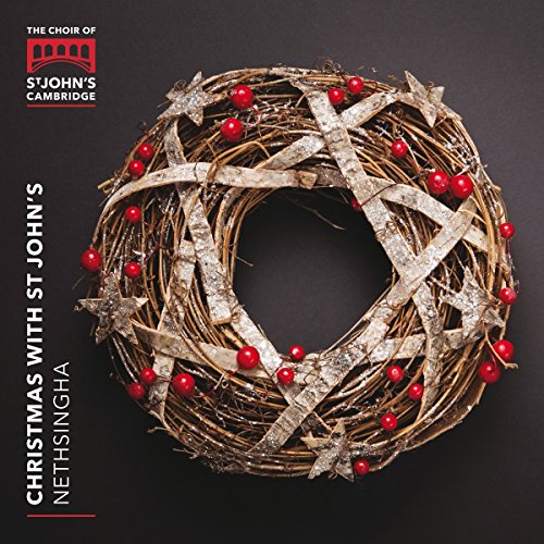 Christmas album cover featuring a twig wreath with red berries on a dark background.