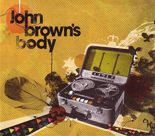 "Album cover featuring a reel-to-reel tape recorder, skulls, and birds on a yellow background."