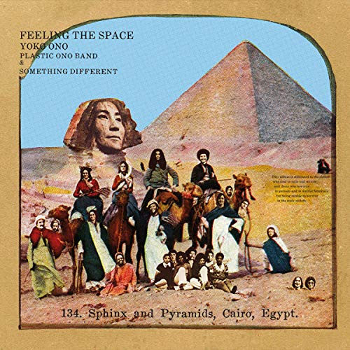 Album cover showing Yoko Ono's face on a Sphinx before pyramids with people nearby.