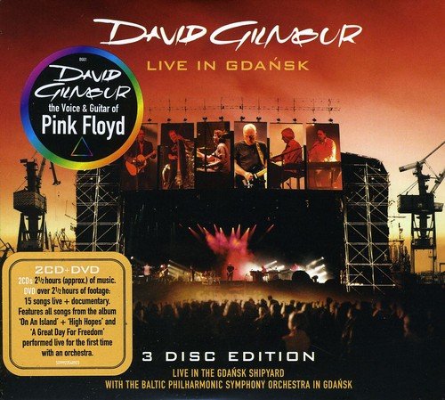 "David Gilmour concert DVD cover with outdoor stage and audience, red sky background."