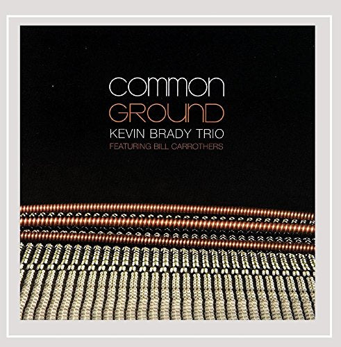 "CD cover with 'common GROUND' in white and orange text on black background."