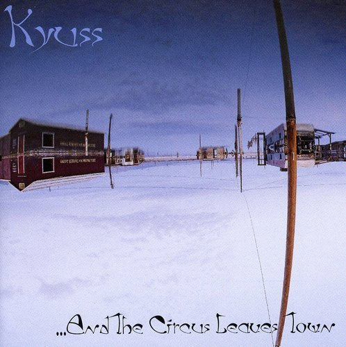 "Album cover with snowy circus scene, 'Kyuss' at top, '...And The Circus Leaves Town' at bottom."