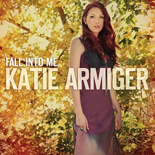 "Album cover featuring a woman in a purple dress standing among autumn leaves."