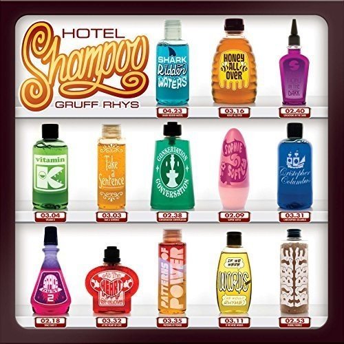 Image shows 12 hotel shampoo bottles on three shelves, various colors and labels.