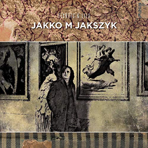 "Vinyl album cover with distressed artwork, featuring a man surrounded by framed images."