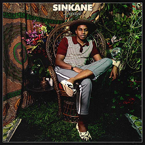 "Album cover with a man sitting in a wicker chair surrounded by plants."