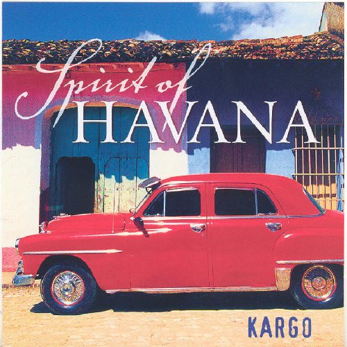 "Album cover featuring a red vintage car in front of a colorful building."