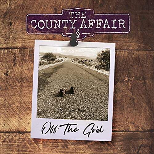 CD cover with a rural road image pinned to a wood background.