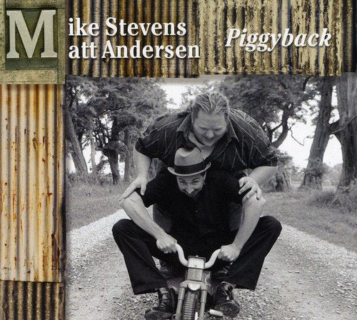 "Album cover featuring a man carrying another on his back on a bicycle."