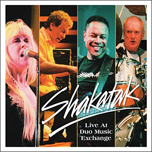 "CD cover featuring four band members of Shakatak performing on stage."