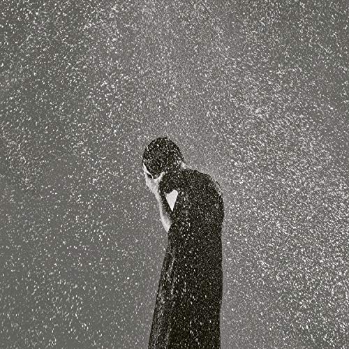 Black vinyl record cover with a man standing in the rain.