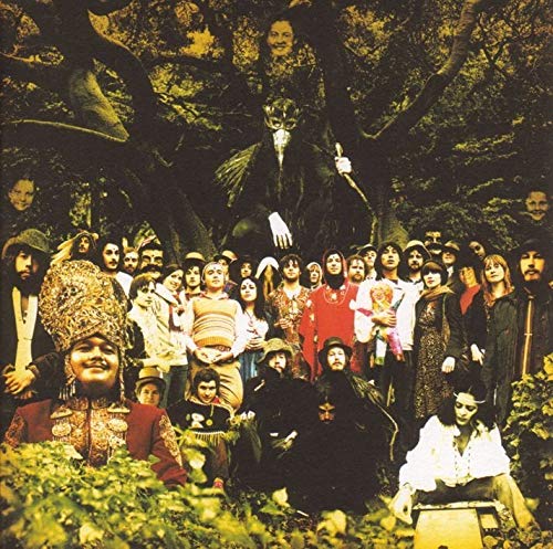 Album cover: large group portrait with figures in a forest setting.