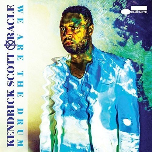 CD cover featuring Kendrick Scott, portrait with blue and white effects.